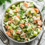Salmon Cucumber Salad Recipe – The Best 5 Paleo Twists Ever 7 Tasty-style overhead shot of creamy salmon cucumber salad in a white bowl with dill and cucumber