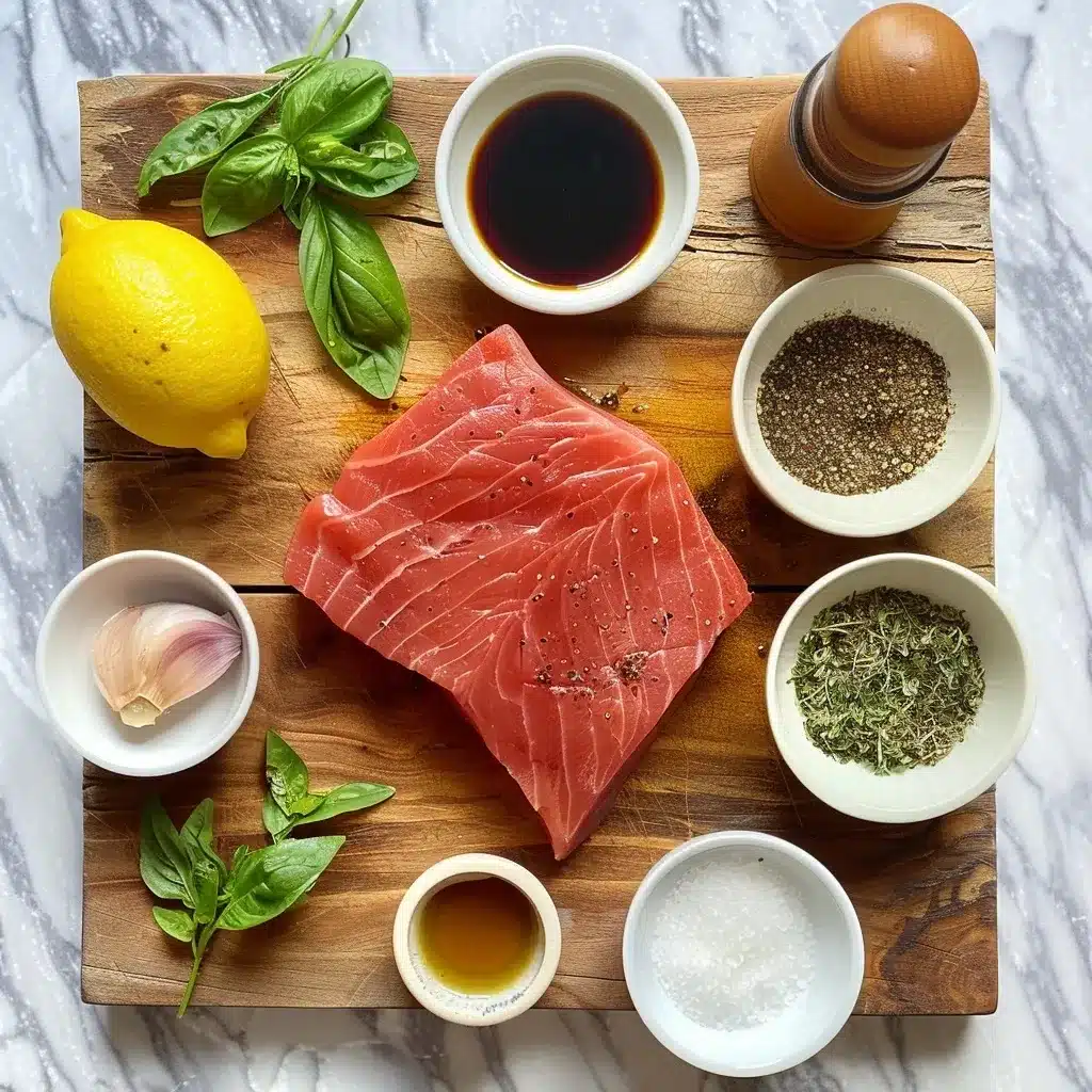 Easy Air Fryer Tuna Steak Recipe for Perfectly Juicy Results 9 Top-down view of tuna steak and seasonings including olive oil, lemon juice, soy sauce, garlic powder, dried herbs, salt, and pepper arranged on a wooden board.