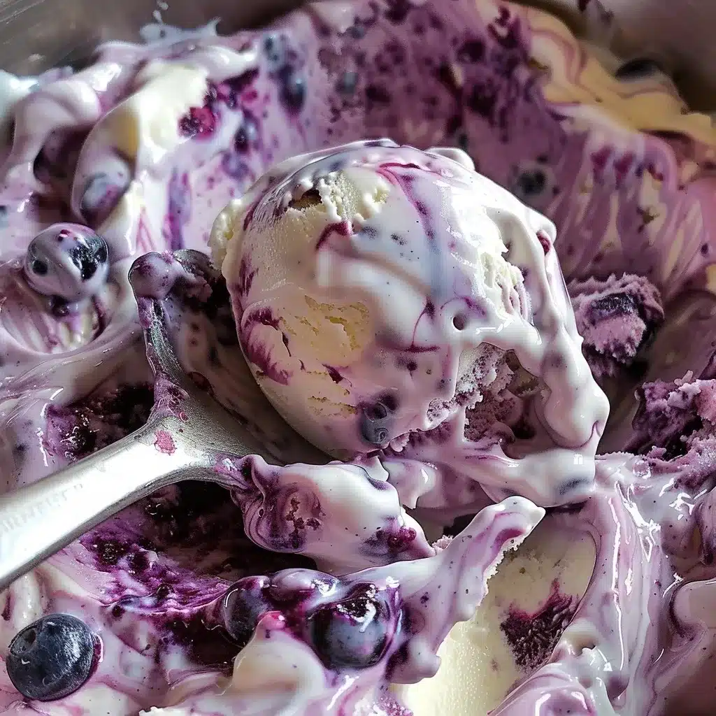 Blueberry Cheesecake Ice Cream Recipe: Irresistibly Creamy & Easy to Make 10 swirling blueberry sauce into cheesecake ice cream