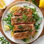 Easy Air Fryer Tuna Steak Recipe for Perfectly Juicy Results 8 Tasty-style seared tuna steak with pepper and herbs, served on arugula with fresh dill, plated for a modern recipe video look.