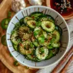 Spicy Cucumber Salad Recipe – The Best 10-Minute Flavor Bomb 7 spicy cucumber salad recipe in white bowl with chili oil